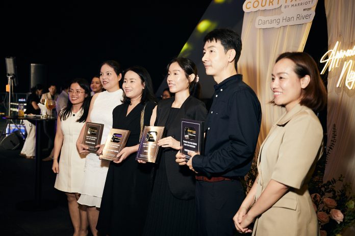 Representatives from leading travel partners receive recognition awards during the Travel Partner Appreciation Night at Courtyard by Marriott Danang Han River.